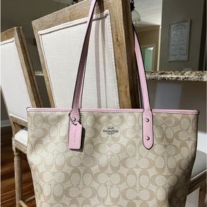 Coach purse with pink trim